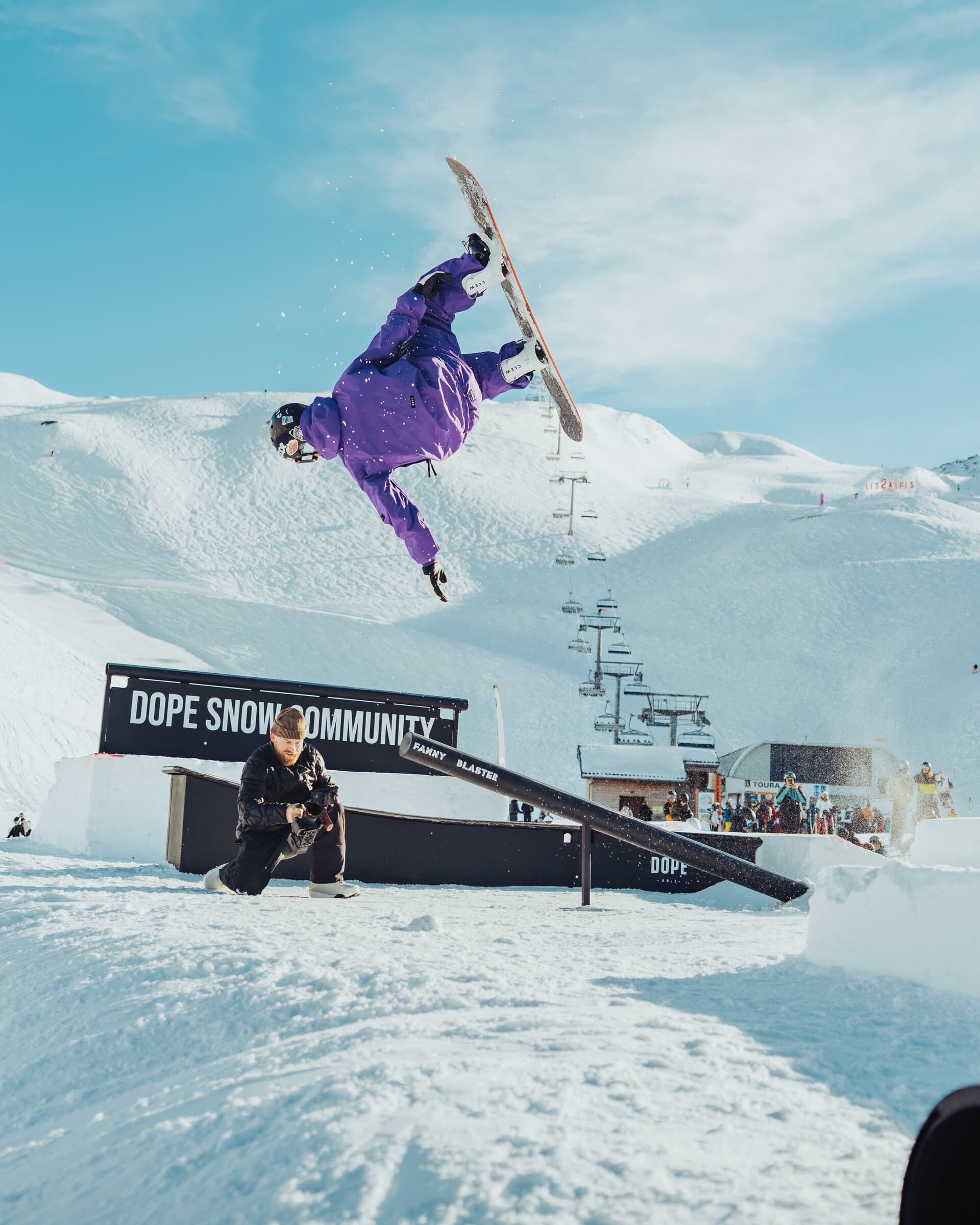 Snowboarder doing rail trick with Clew bindings